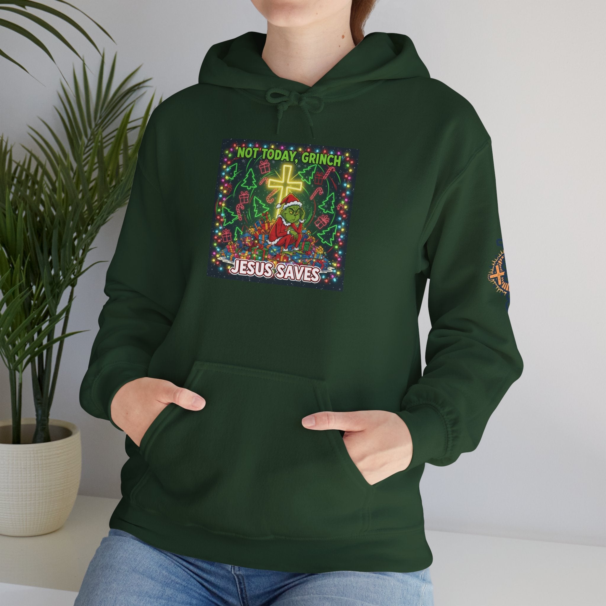 🎄 Not Today, Grinch – Jesus Saves | Funny Christian Christmas Hoodie | Festive Green & Red Cartoon Style | Bold Faith Holiday Tee by Uplifted Gear Printify