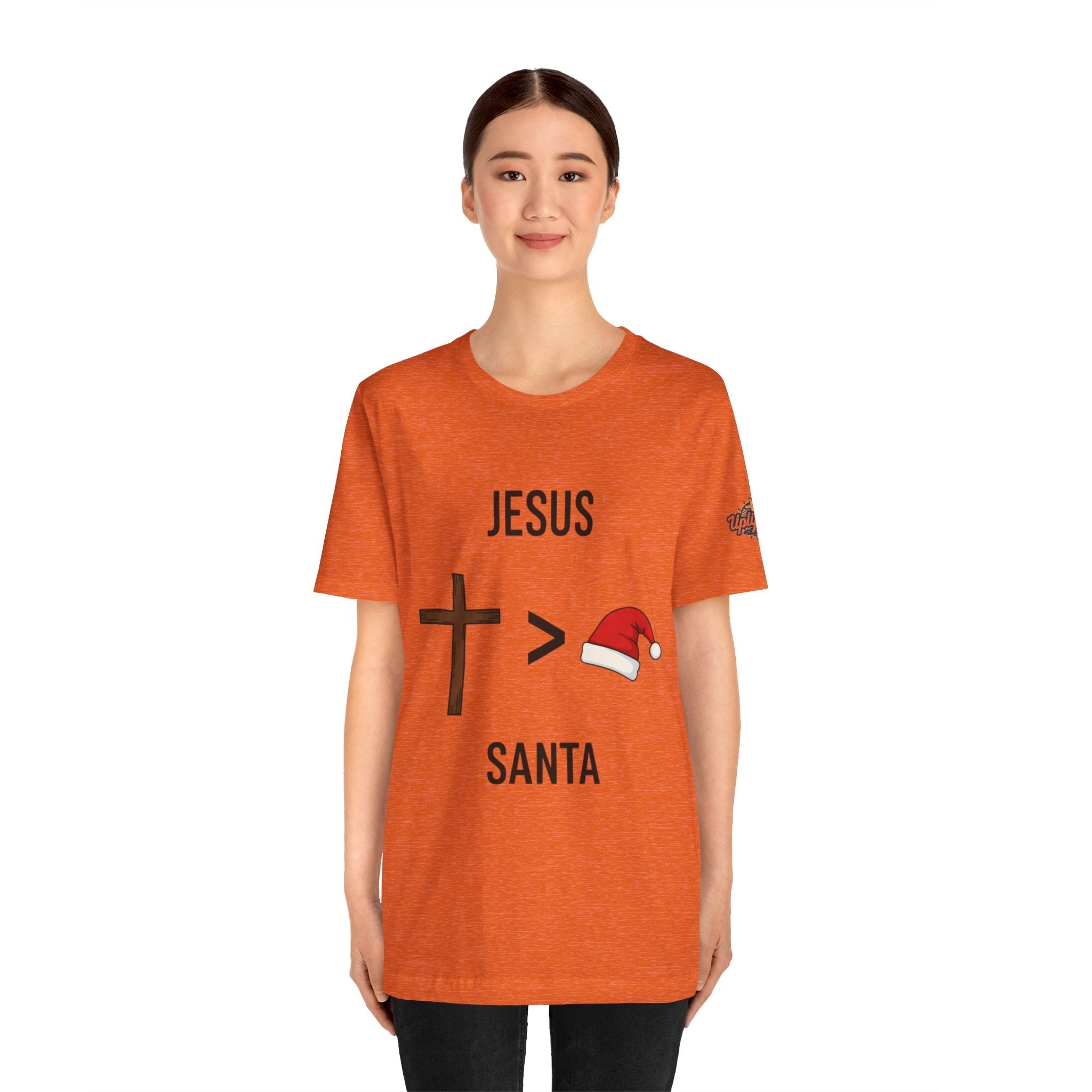 🎄 Jesus > Santa – Minimalist Christian Christmas T-Shirt | Bold Faith Over Holiday Tee | Cross vs Santa Hat Design | Uplifted Gear Printify