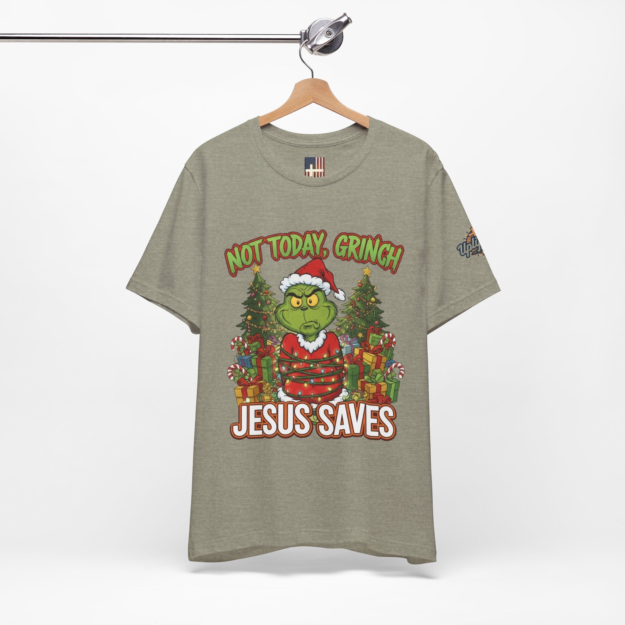 🎄 Not Today, Grinch – Jesus Saves | Funny Christian Christmas T-Shirt | Sulking Grinch & Glowing Cross | Bold Neon Faith Tee by Uplifted Gear Printify
