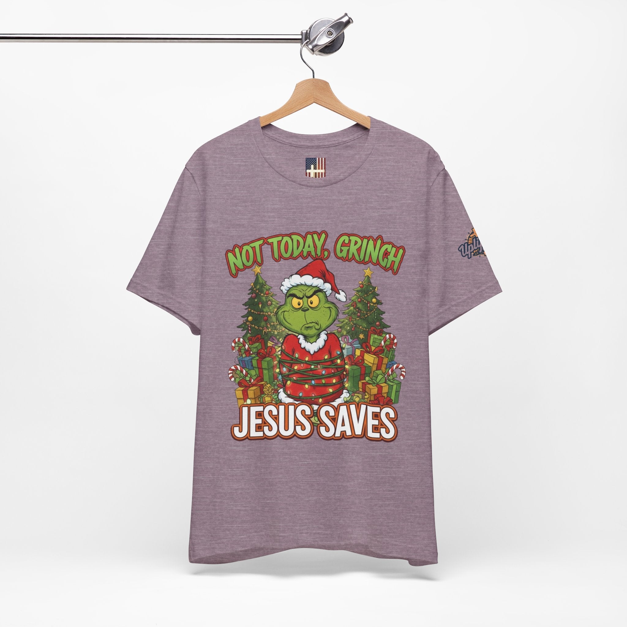 🎄 Not Today, Grinch – Jesus Saves | Funny Christian Christmas T-Shirt | Sulking Grinch & Glowing Cross | Bold Neon Faith Tee by Uplifted Gear Printify