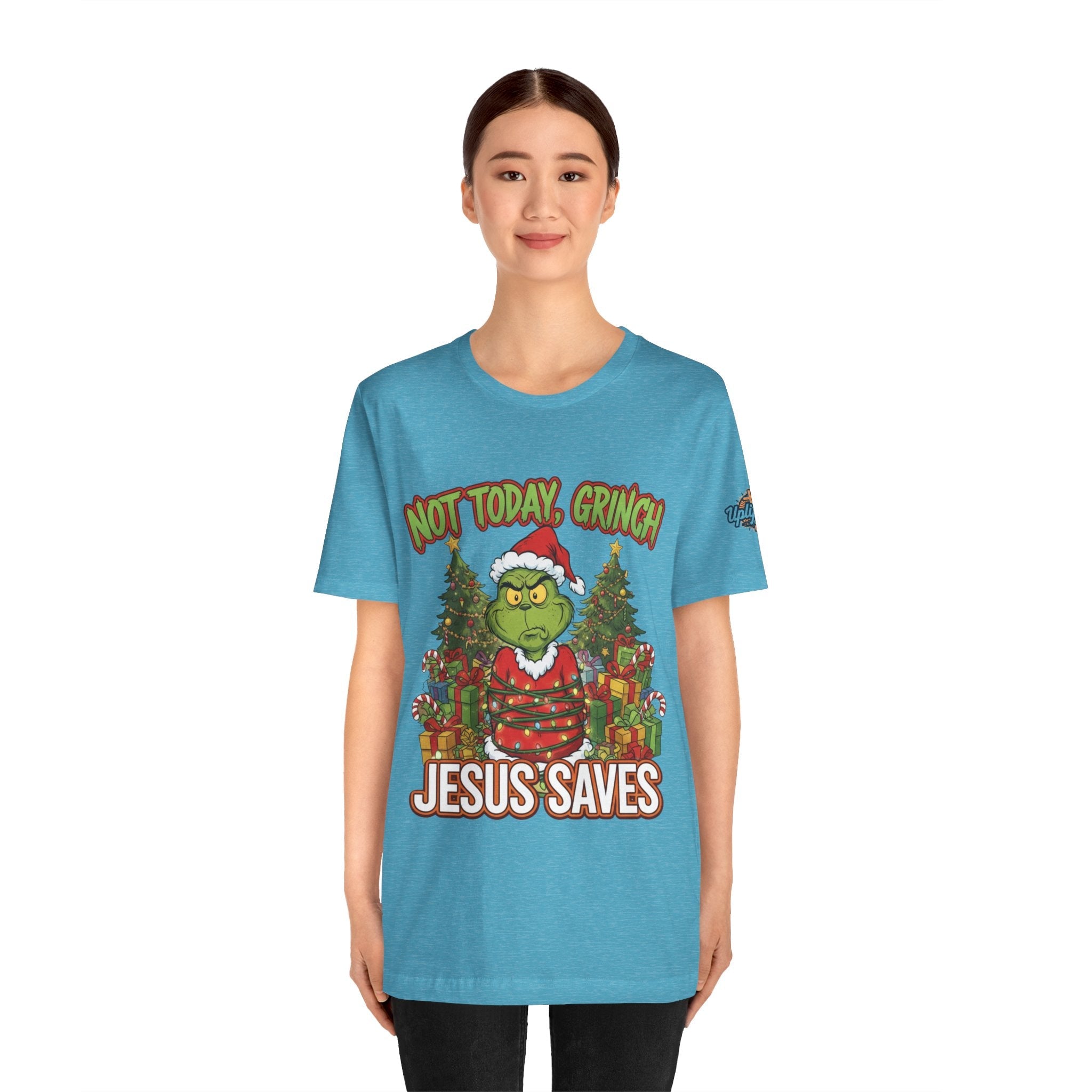 🎄 Not Today, Grinch – Jesus Saves | Funny Christian Christmas T-Shirt | Sulking Grinch & Glowing Cross | Bold Neon Faith Tee by Uplifted Gear Printify