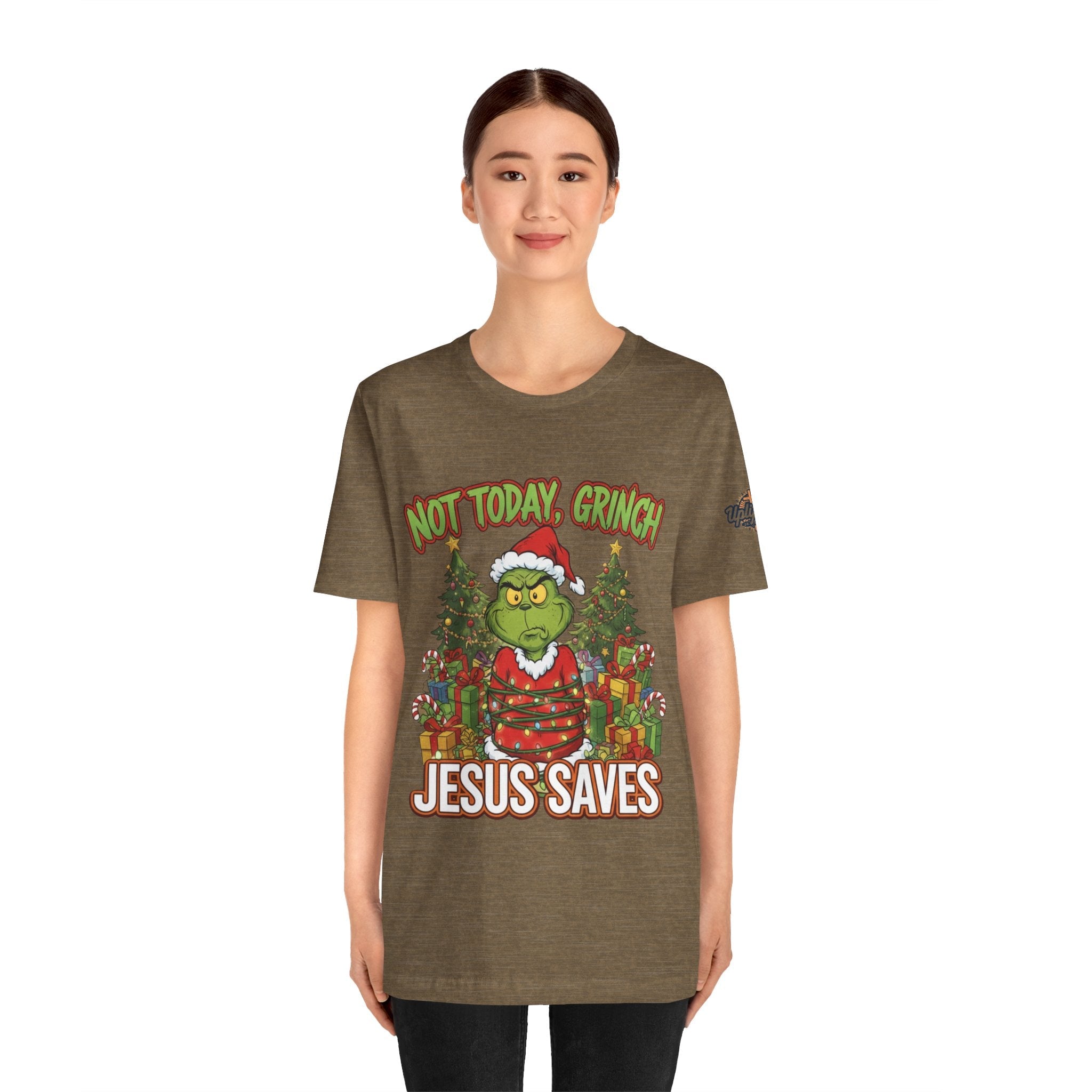 🎄 Not Today, Grinch – Jesus Saves | Funny Christian Christmas T-Shirt | Sulking Grinch & Glowing Cross | Bold Neon Faith Tee by Uplifted Gear Printify